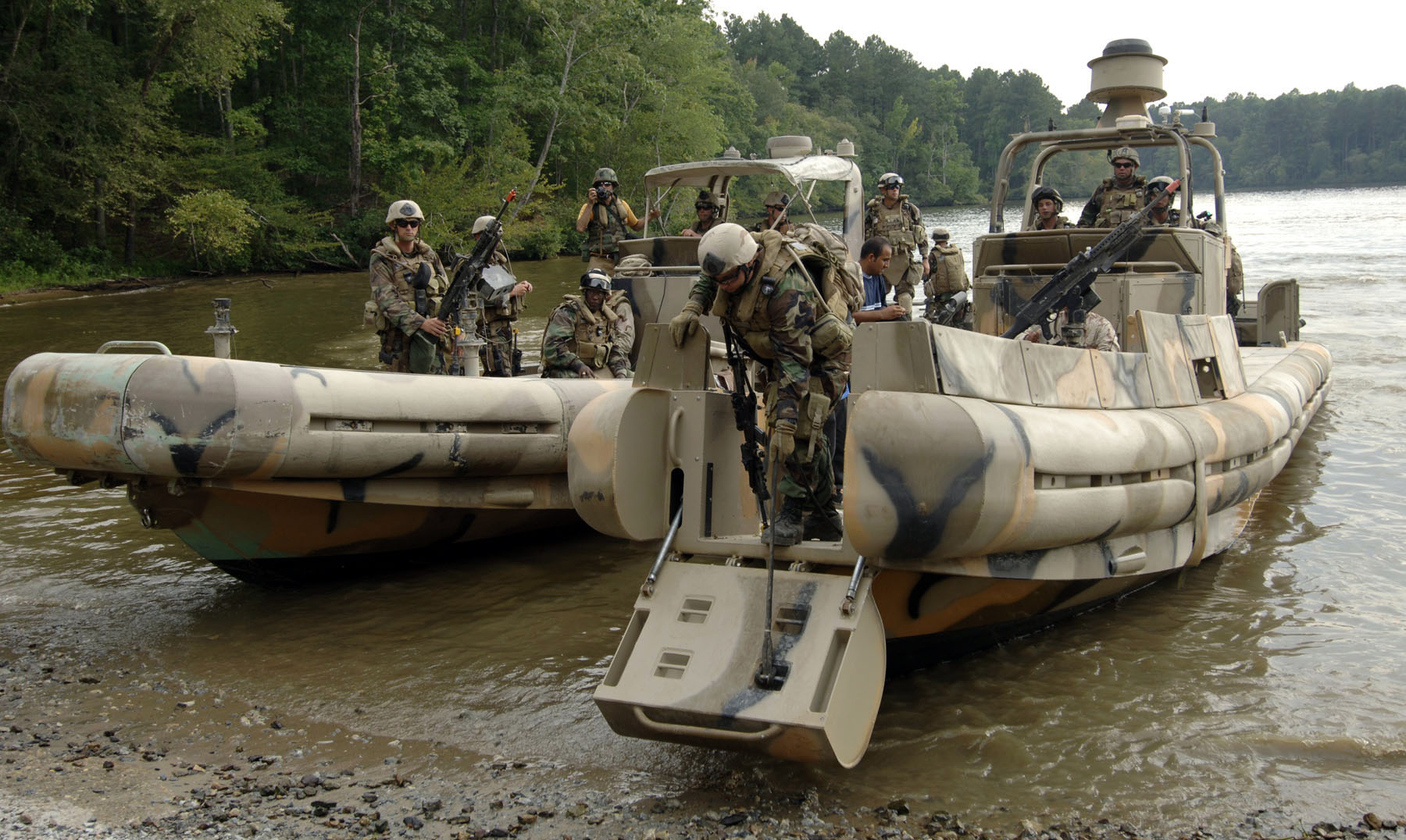 US_Navy_070910-N-6639M-043_Sailors_assigned_to_Riverine_Squadron_(RIVRON)_2_come_ashore_with_two_simulated_detainees_to_be_turned_over_to_Mobile_Security_Squadron_3,_Det._33,_during_COMET_2007.jpg