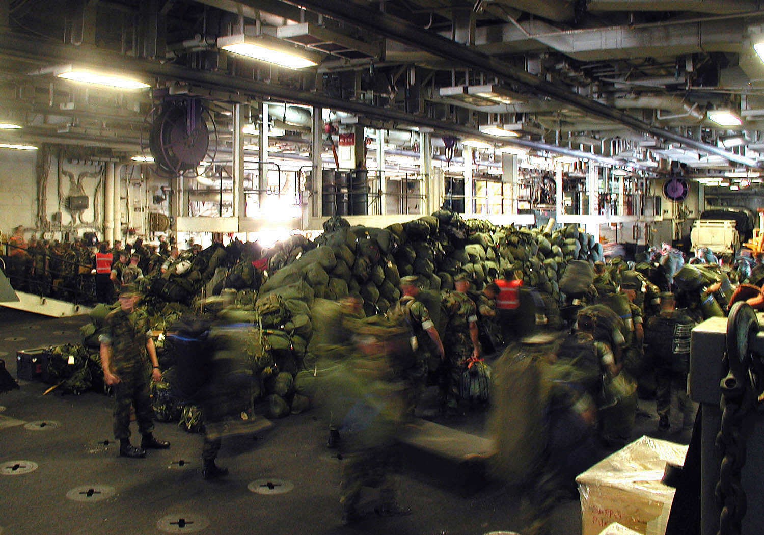 US_Navy_020905-N-9802B-001_Marines_load_their_gear_in_the_welldeck_aboard_the_Wasp-class_amphibious_assault_ship_USS_Essex.jpg