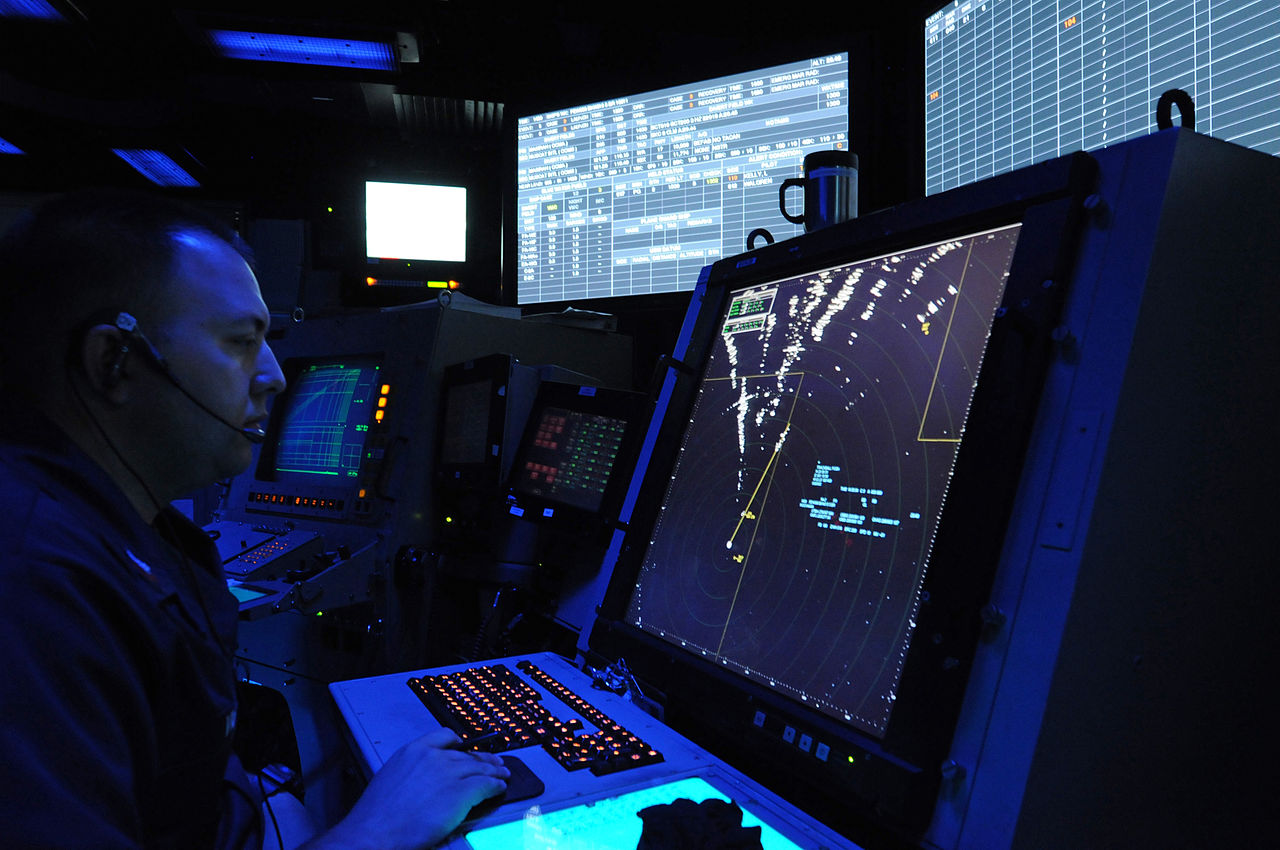 1280px-US_Navy_110720-N-TU894-195_Air-Traffic_Controller_1st_Class_David_Viger_controls_aircraft_in_the_Carrier_Air_Traffic_Control_Center_aboard_the_airc.jpg