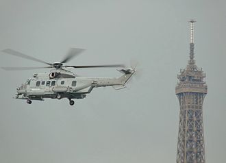 330px-Eurocopter_EC-725_Cougar_MkII_and_Eiffel_Tower.JPG