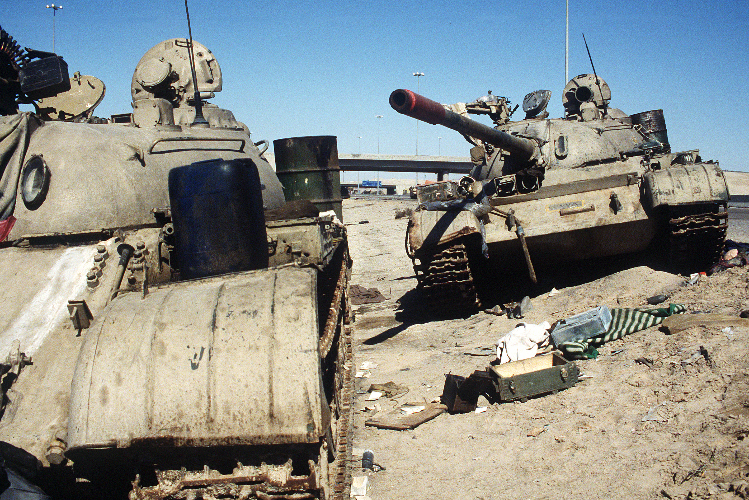 An-Iraqi-T-54-T-55-or-Type-59-and-T-55A-on-Basra-Kuwait-Highway-near-Kuwait.jpeg