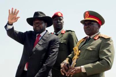 president_salva_kiir_l_accompanied_by_army_chief_of_staff_paul_malong_awan_r_waves_during_an_independence_day_ceremony_in_juba-094dc-395e8.jpg