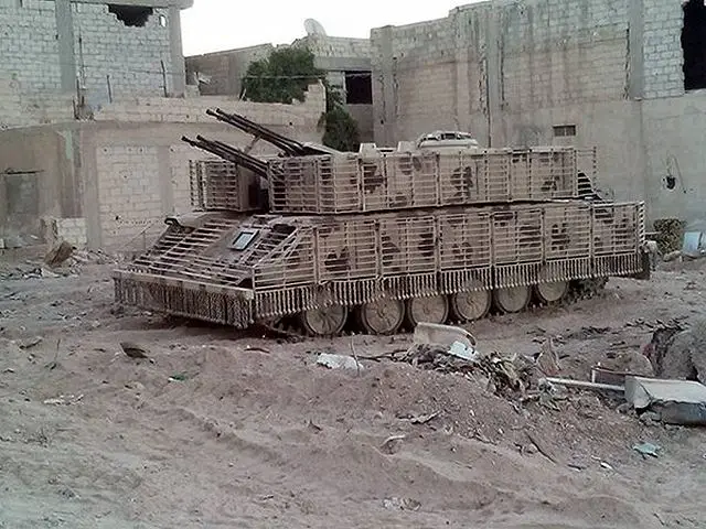 Syrian_army_uses_local-made_armour_cage_to_increase_protection_of_T-72_tanks_and_ZSU-23-4_640_001.jpg