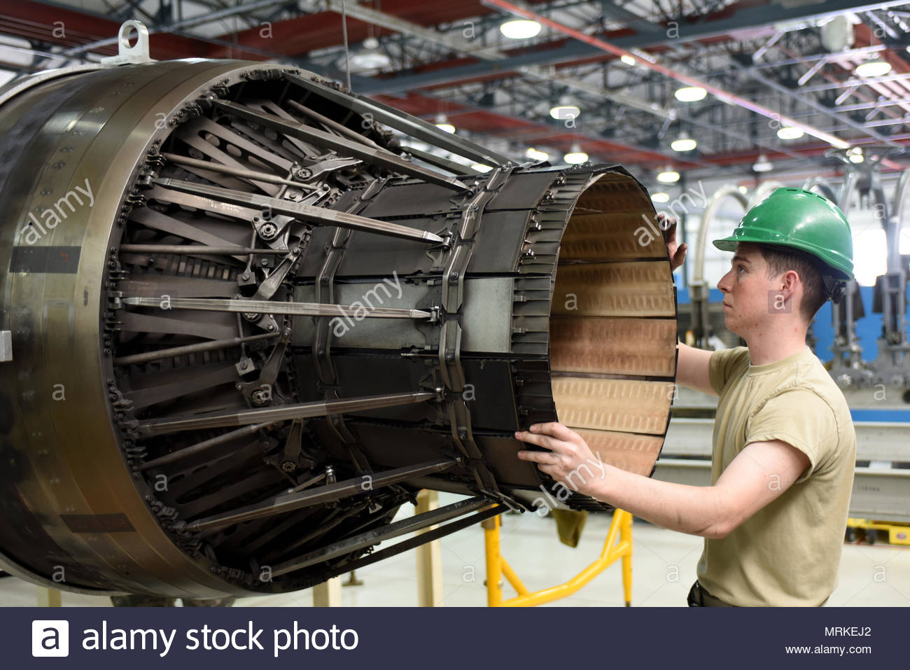 an-airman-assigned-to-the-48th-component-maintenance-squadron-maneuvers-an-f-15-engine-at-royal-air-force-lakenheath-england-june-13-the-48th-cms-is-responsible-for-the-installations-propulsions-shop-where-maintenance-is-performed-on-f-15-engines-us-air-force-photoairman-1st-class-eli-chevalier-MRKEJ2.jpg