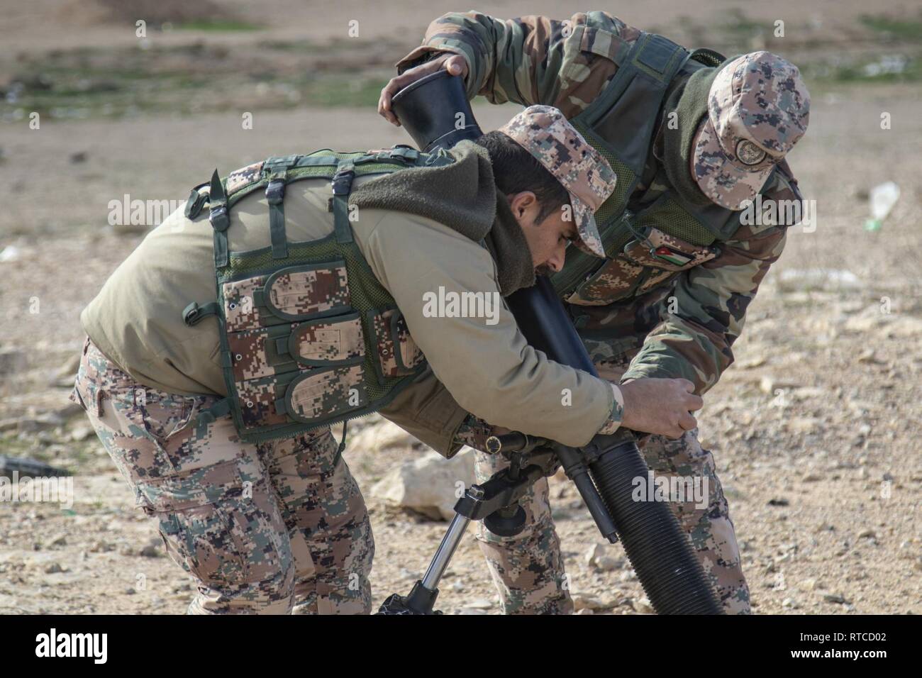soldiers-with-the-jordan-armed-forces-10th-border-guard-force-prepare-an-m252-81-mm-mortar-system-for-a-joint-training-exercise-with-the-california-national-guards-1st-squadron-18th-cavalry-regiment-at-a-range-outside-of-amman-jordan-on-feb-13-2019-the-10th-bgf-continues-to-train-alongside-their-us-army-counterparts-as-part-of-the-jordan-operational-engagement-program-solidifying-an-ongoing-and-strong-partnership-of-mutual-objectives-and-meeting-common-security-challenges-RTCD02.jpg