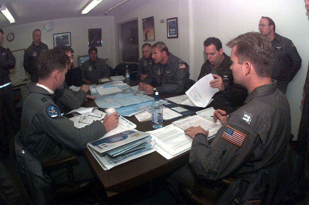 7th-and-8th-airlift-squadrons-aircrew-members-sit-at-a-table-during-a-preflight-ff1b6e-1024.jpg