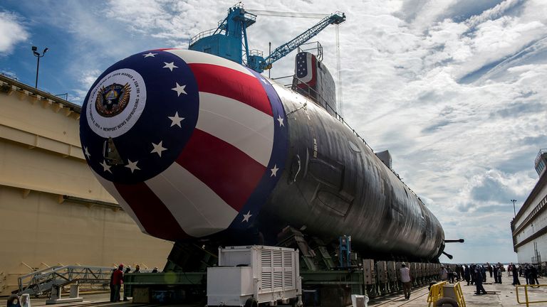 The Virginia-class attack submarine Pre-commissioning Unit (PCU) John Warner (SSN 785) is moved to Newport News Shipbuilding's floating dry dock in preparation for the September 6 christening in Newport News, Virginia, U.S. August 31, 2014. To match Special Report CHINA-CYBER/CLOUDHOPPER U.S. Navy/John Whalen/Huntington Ingalls Industries/Handout via REUTERS ATTENTION EDITORS - THIS IMAGE WAS PROVIDED BY A THIRD PARTY.
