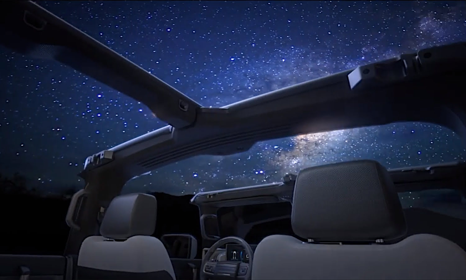 Hummer-EV-Pickup-Interior-001-Roof-Open-Night-Sky.jpg
