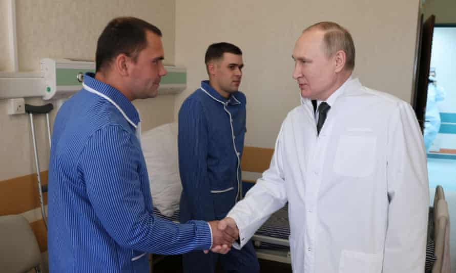 Russian President Vladimir Putin visits soldiers wounded during the conflict in Ukraine at the Mandryk Military Clinical Hospital in Moscow, Russia.