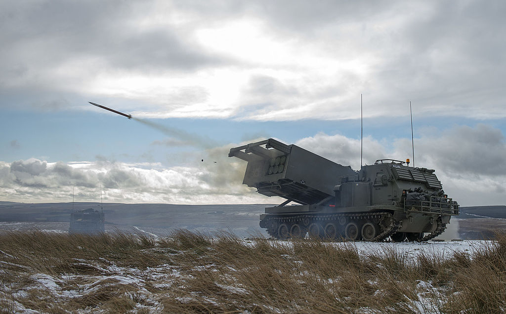 1024px-MLRS_captured_as_a_training_round_leaves_the_launch_tube_on_the_ranges_at_Otterburn._MOD_45158570-1.jpg