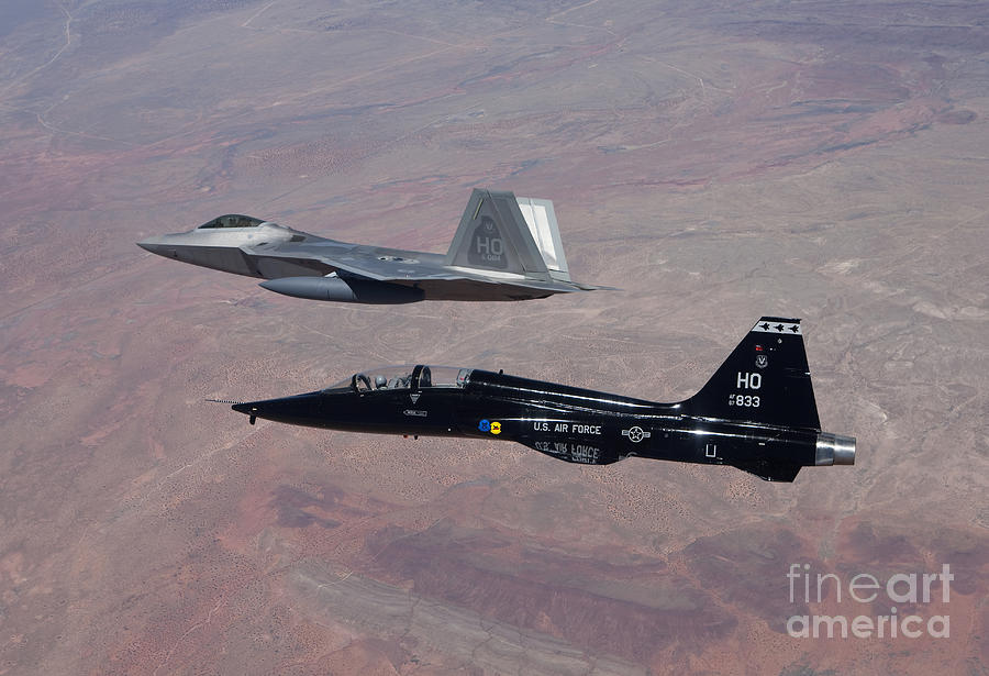 an-f-22-raptor-and-a-t-38-talon-fly-high-g-productions.jpg