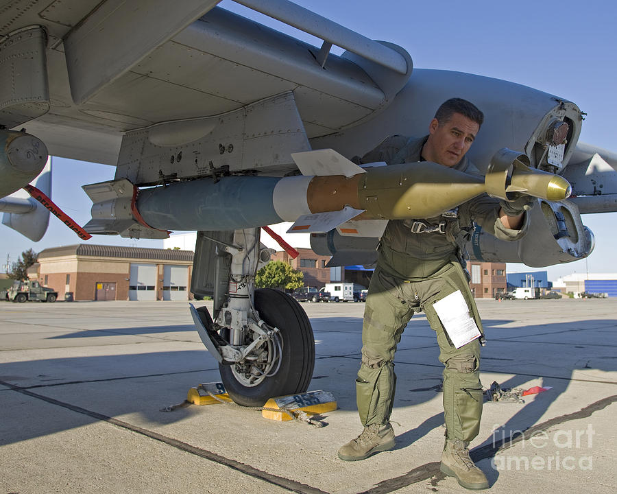 a-pilot-inspects-a-gbu-12-laser-guided-high-g-productions.jpg