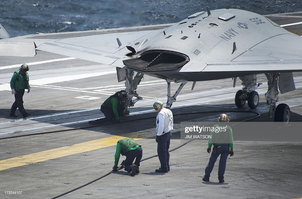 air-wing-maintenance-personnel-check-the-arresting-line-after-the-picture-id173244107