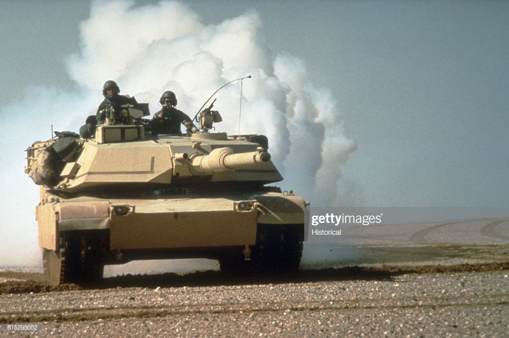 an-m1a1-abrams-main-battle-tank-lays-a-smoke-screen-during-maneuvers-picture-id615295082