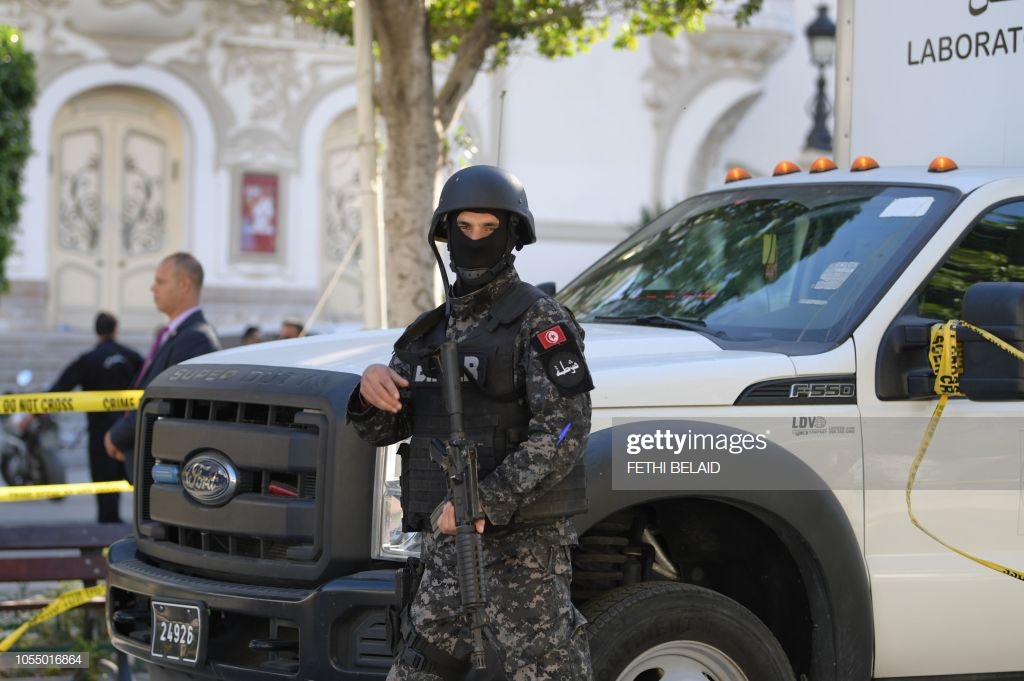 member-of-the-tunisian-security-forces-stands-guard-at-the-site-of-a-picture-id1055016864