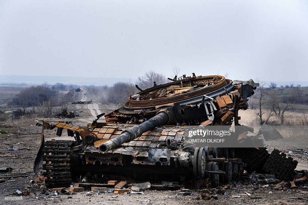 picture-taken-on-march-26-shows-a-destroyed-t72-tank-on-a-road-near-picture-id467623384