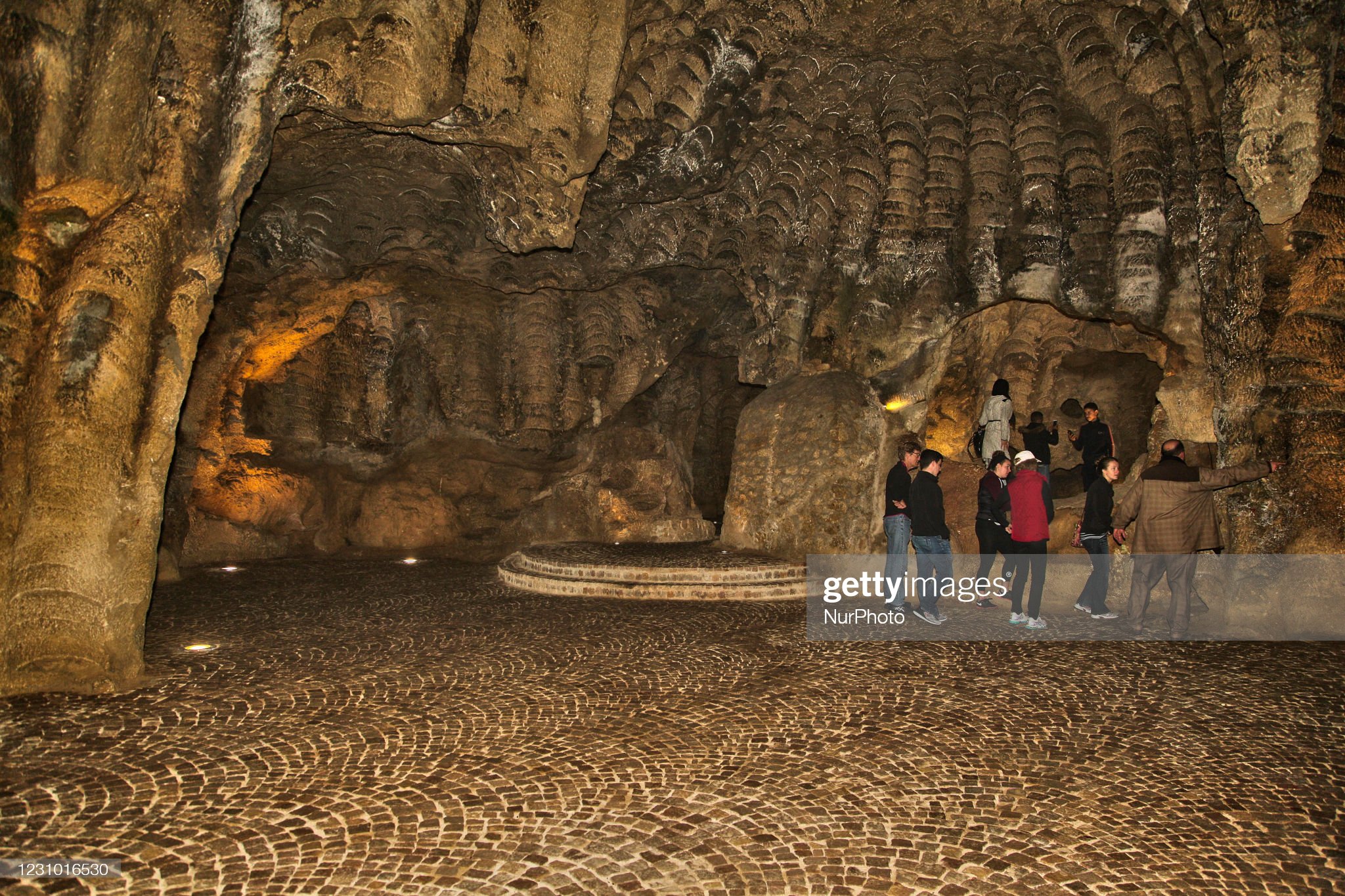 tourists-walk-through-the-caves-of-hercules-in-tangier-morocco-africa-picture-id1231016530
