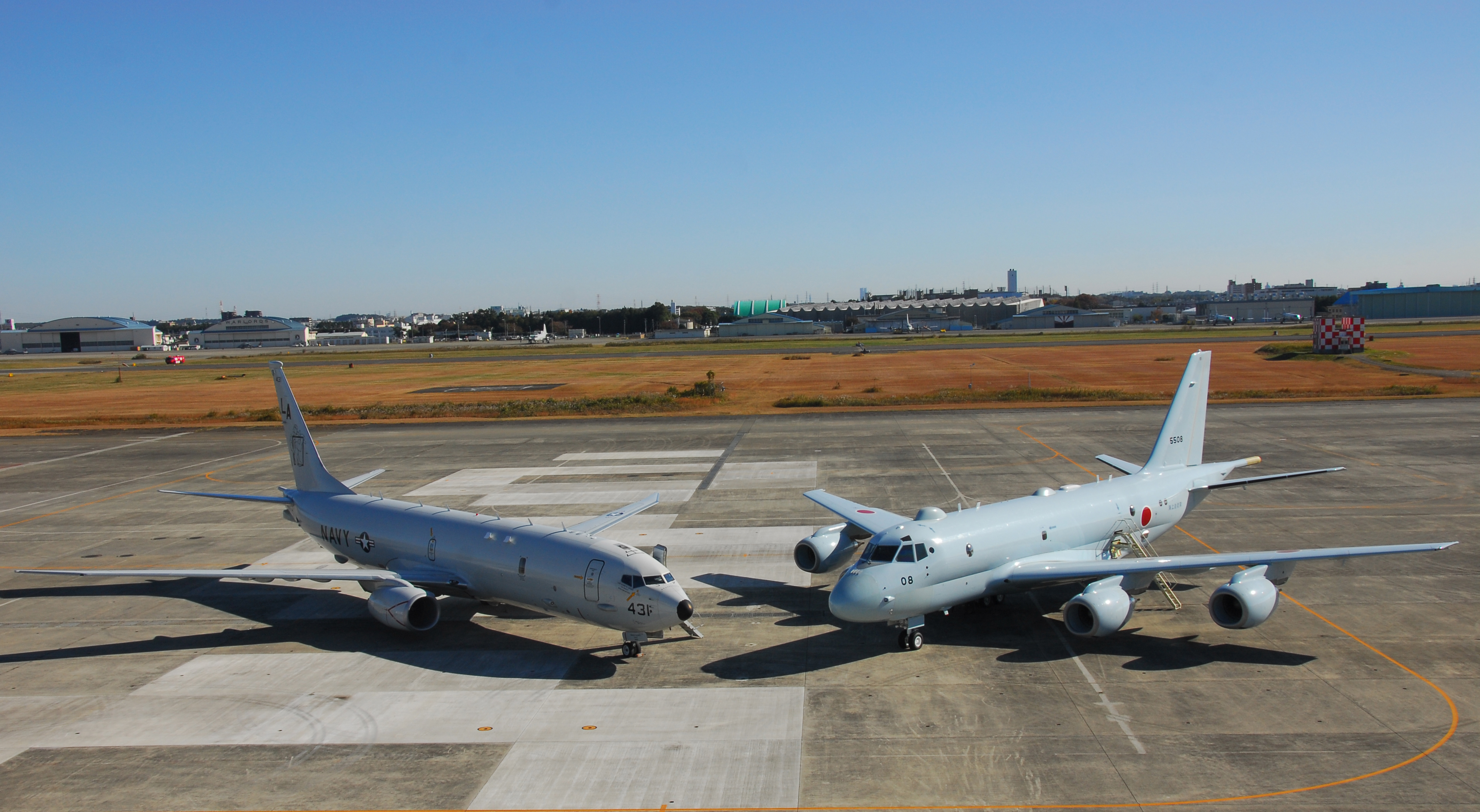 P-8A_of_VP-5_and_Japanese_Kawasaki_P-1_at_NAF_Atsugi_in_2014.JPG