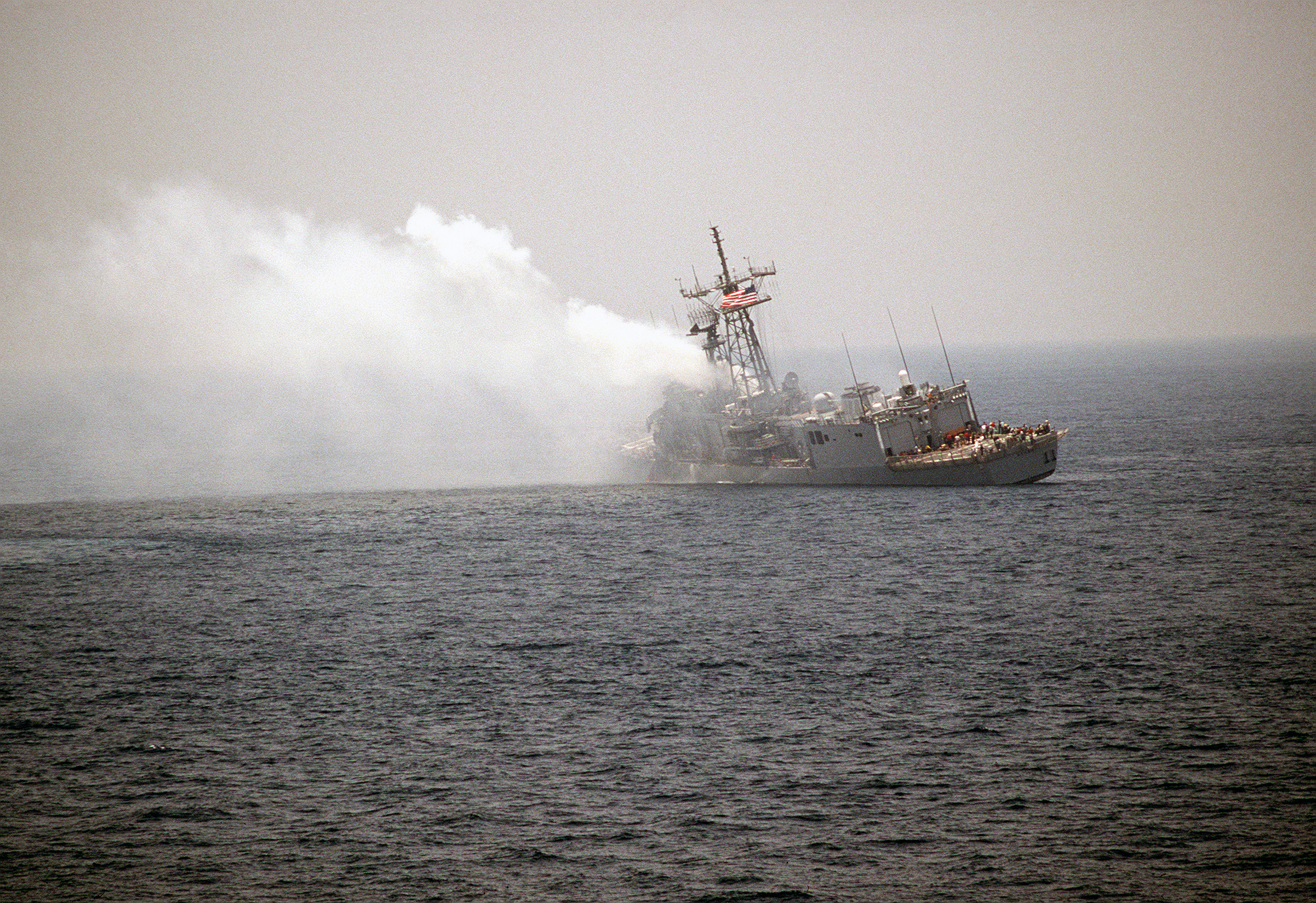 A_port_quarter_view_of_the_guided_missile_frigate_USS_STARK_%28FFG_31%29_listing_to_port_after_being_struck_by_an_Iraqi-launched_Exocet_missile_-_DPLA_-_ea32d9117fb4973359103931e4327595.jpeg