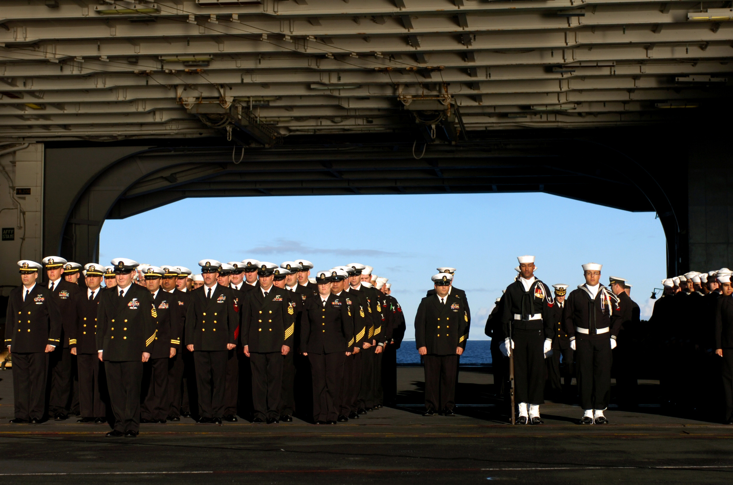 US_Navy_070130-N-0555B-039_Sailors_assigned_to_the_Eagles_of_Strike_Fighter_Squadron_One_One_Five_%28VFA-115%29_honor_one_of_their_own_during_a_burial_at_sea_ceremony_held_aboard_USS_Ronald_Reagan_%28CVN_76%29.jpg