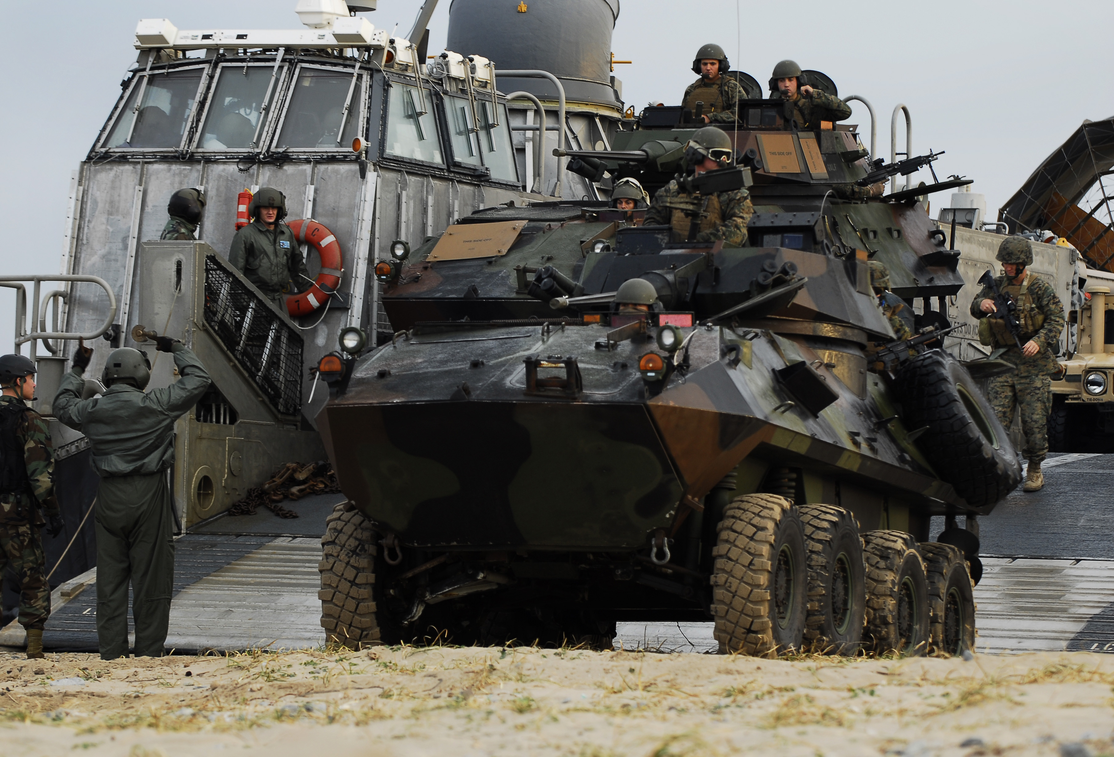 US_Navy_091104-N-0807W-159_Marines_assigned_to_the_31st_Marine_Expeditionary_Unit_%2831st_MEU%29_unload_assault_vehicles_from_a_landing_craft%2C_air_cushion_from_the_amphibious_dock_landing_ship_USS_Harpers_Ferry_%28LSD_49%29.jpg