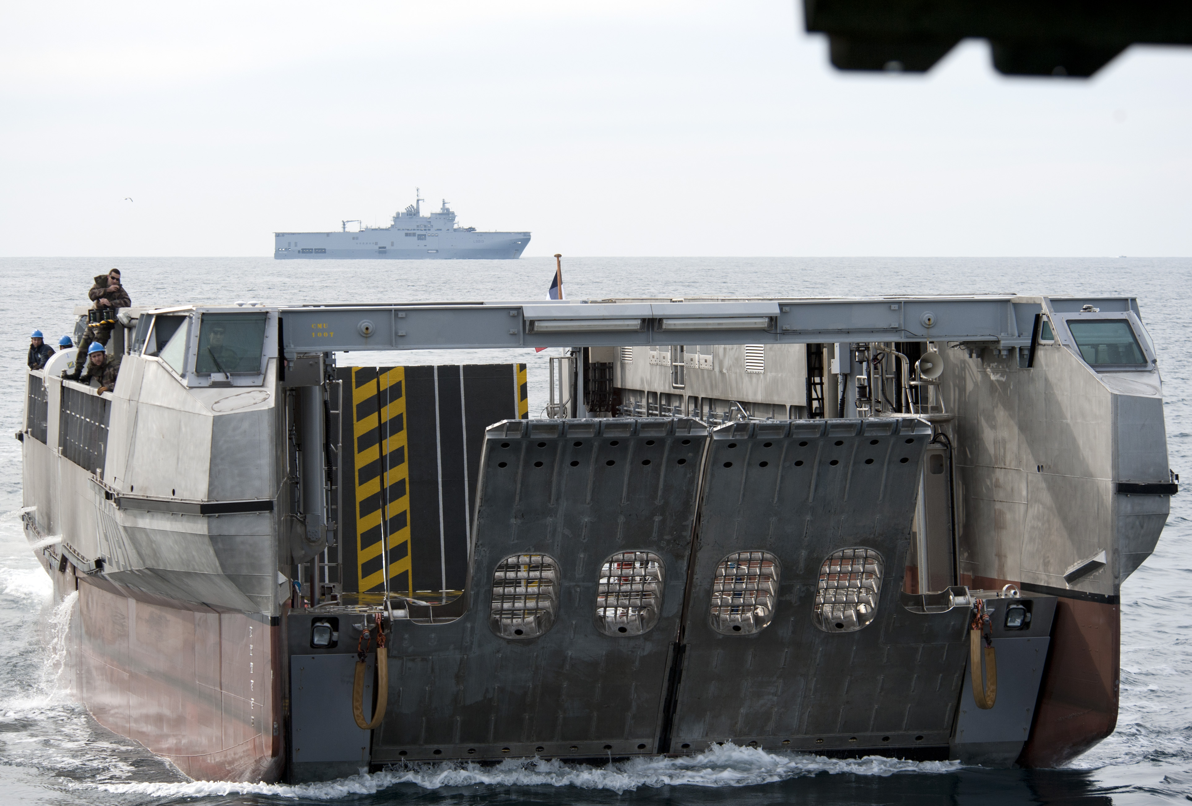 US_Navy_120207-N-YF306-086_A_French_landing_catamaran_(L-CAT)_pulls_into_the_well_deck_of_the_amphibious_assault_ship_USS_WASP_(LHD_1).jpg