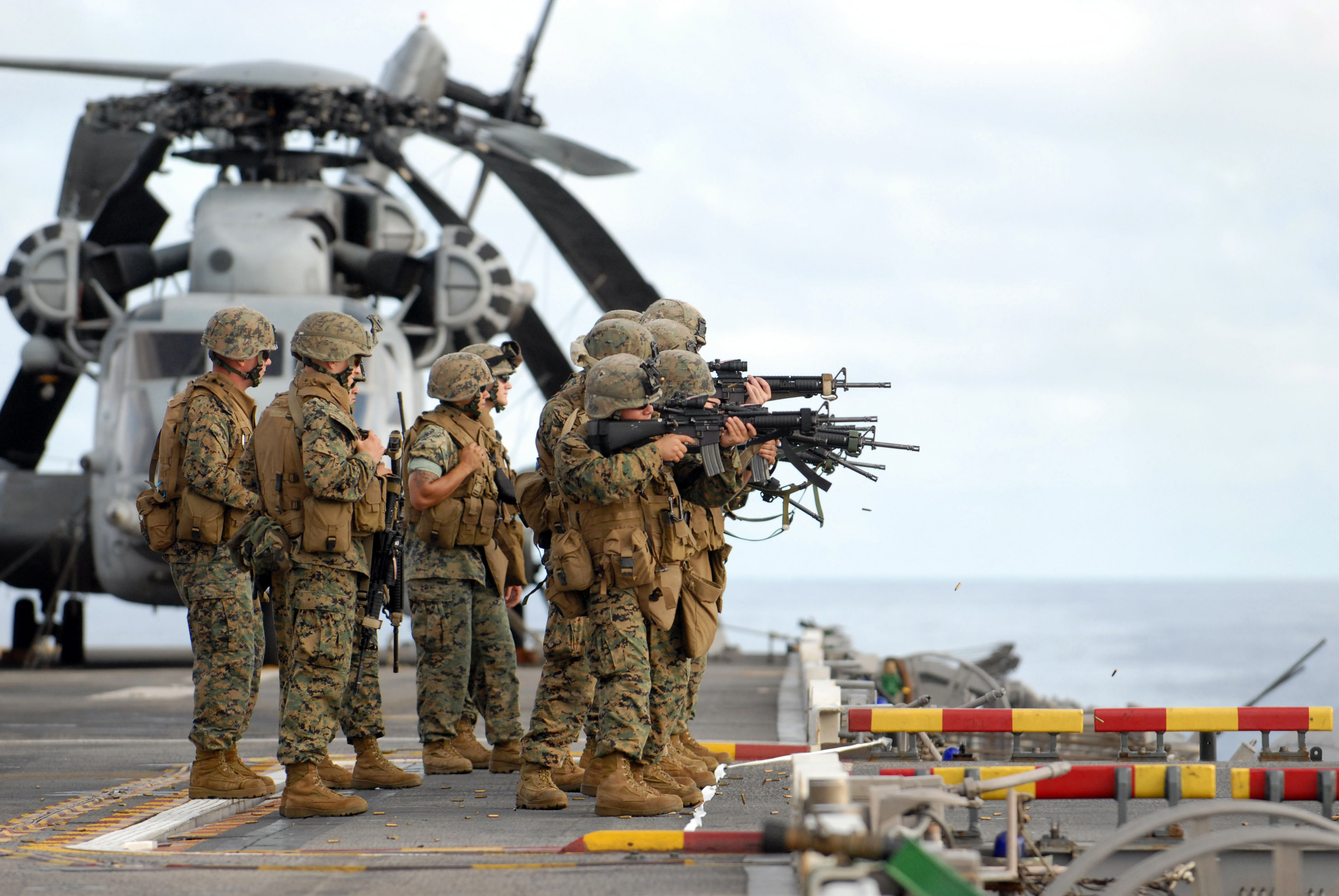 US_Navy_070530-N-4207M-140_Marines_attached_to_the_31st_Marine_Expeditionary_Unit_conduct_marksmanship_training_over_the_portside_elevator_aboard_the_amphibious_assault_ship_USS_Essex_%28LHD_2%29.jpg
