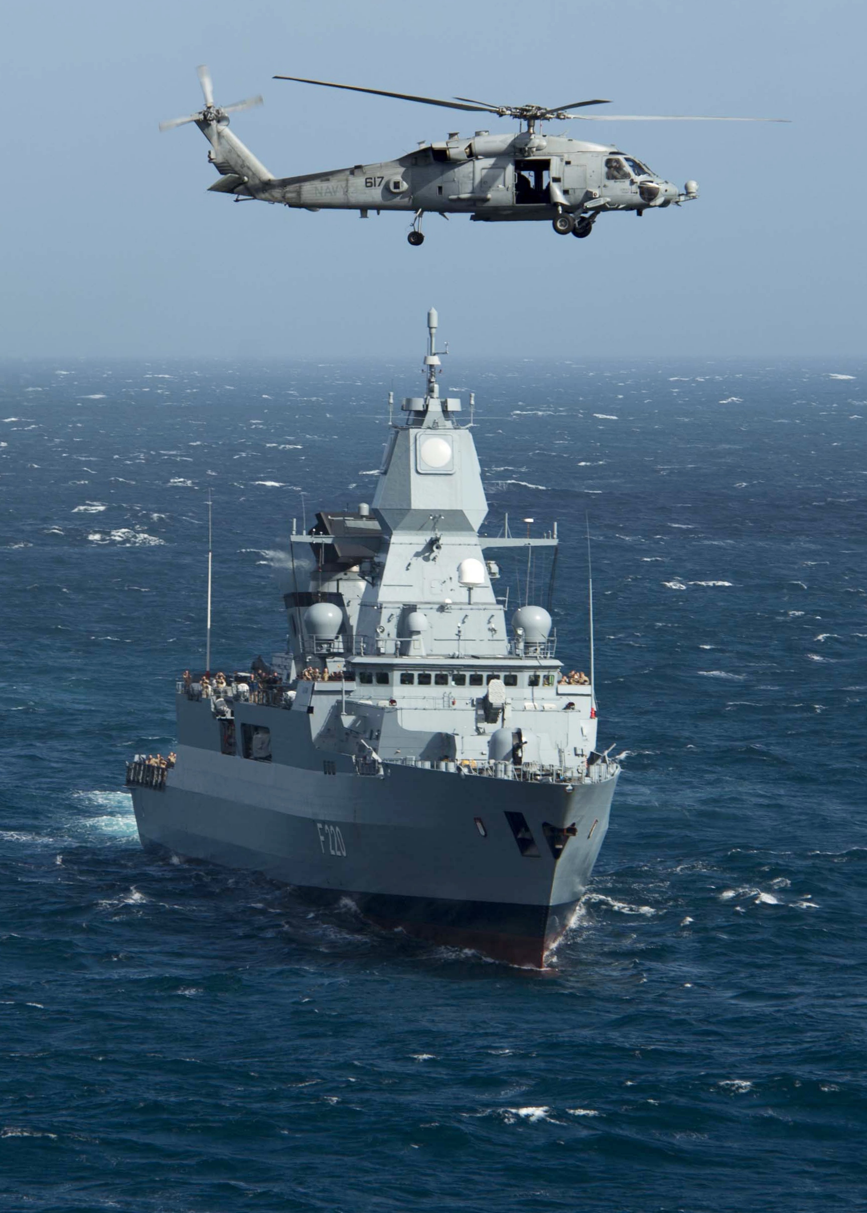 HH-60H_of_HS-5_with_German_frigate_Hamburg_%28F220%29_2013.jpg