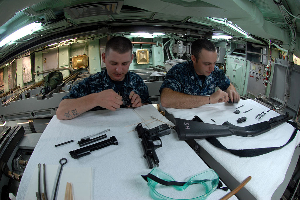 1024px-US_Navy_110621-N-NK458-140_Sailors_conduct_maintenance_on_small_arms_in_the_torpedo_room_aboard_the_Los_Angeles-class_attack_submarine_USS_Helena_%28.jpg