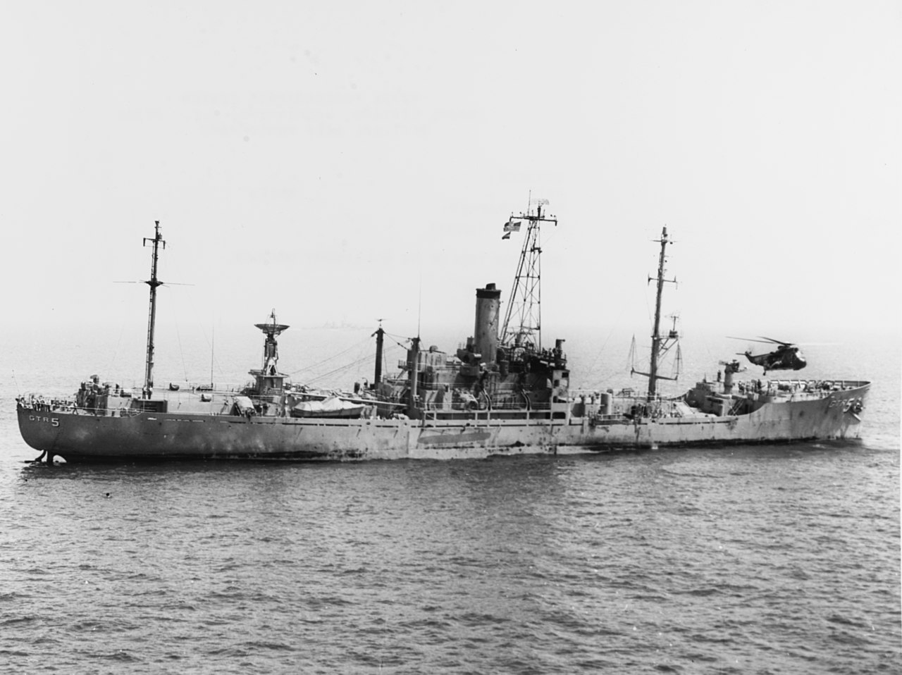 1280px-SH-3A_Sea_King_hovers_over_the_damaged_USS_Liberty_%28AGTR-5%29_on_8_June_1967_%28USN_1123118%29.jpg